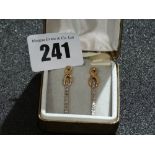 A Pair Of Diamond Set Gold Earrings