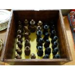 A Carved Wooden Chess Set And Board