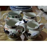 Four Gaudy Welsh Pottery Milk Jugs