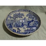 A Blue And White Transfer Decorated Circular Cheese Stand With Landscape Scene