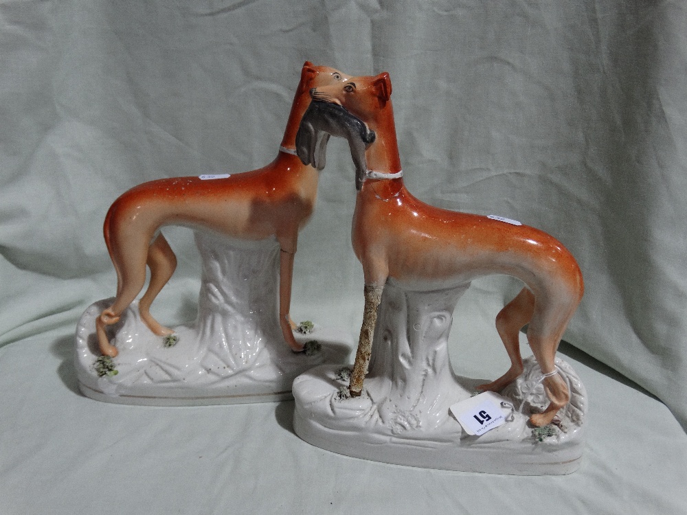 A Pair Of Staffordshire Pottery Greyhound Models (AF) Together With Two Late Staffordshire Pottery