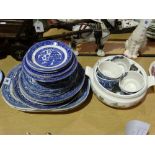 A Quantity Of Willow Patterned Circular Plates And Platters
