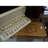 A Cased Set Of Twelve Coffee Spoons Together With A Wooden Cigar Box