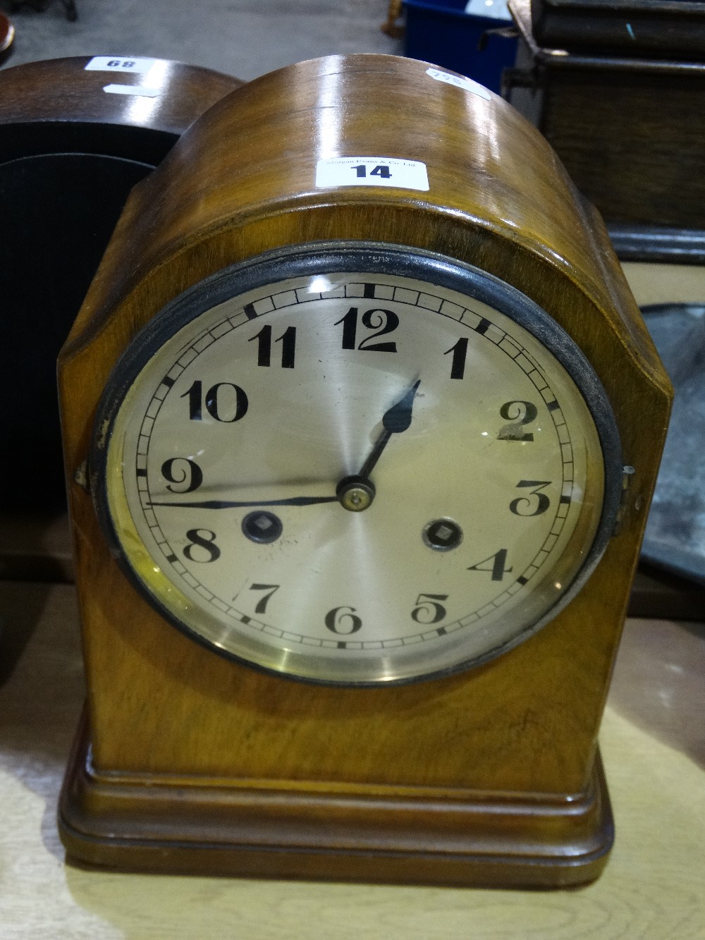 An Edwardian Walnut Encased Mantel Clock With Circular Silvered Dial