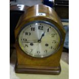 An Edwardian Walnut Encased Mantel Clock With Circular Silvered Dial