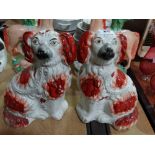 A Pair Of Red And White Staffordshire Pottery Seated Dogs
