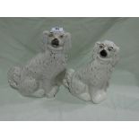 Two Staffordshire Pottery White Seated Dogs