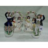 A Pair Of Staffordhsire Pottery Dancing Figures Together With Two Staffordshire Pottery Clock