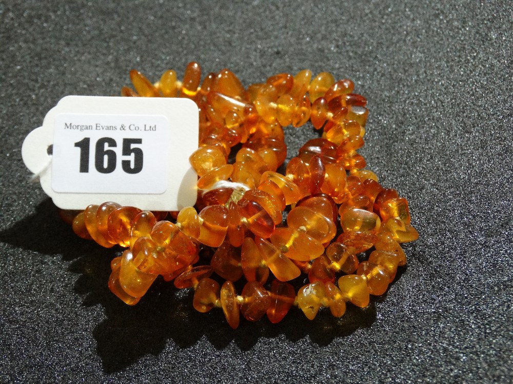 An Amber Bead Necklace And Bracelet