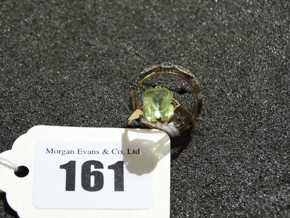 A Nine Carat Gold Green Stone Ring Together With An Eternity Ring