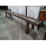 A Pitch Pine Farmhouse Bench On Four Block Supports