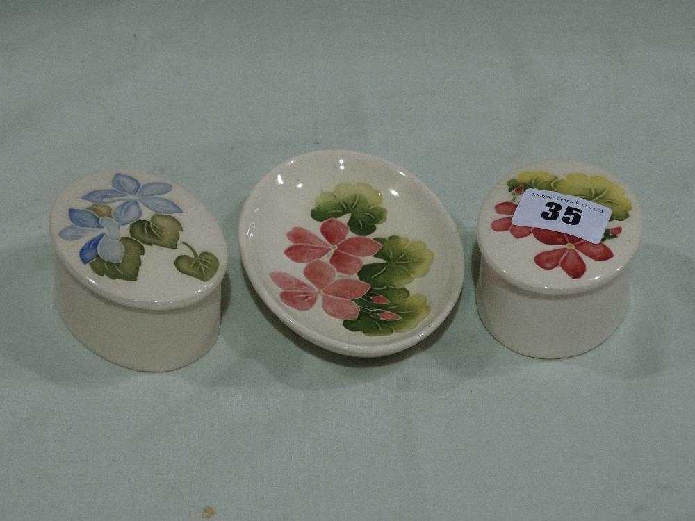 Three Small Cream Ground Moorcroft Pottery Dishes And Boxes