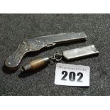 An Interesting Pocket Knife In The Form Of A Pistol Together With A Silver Keyring Whistle