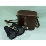 A Pair Of Cased Binoculars