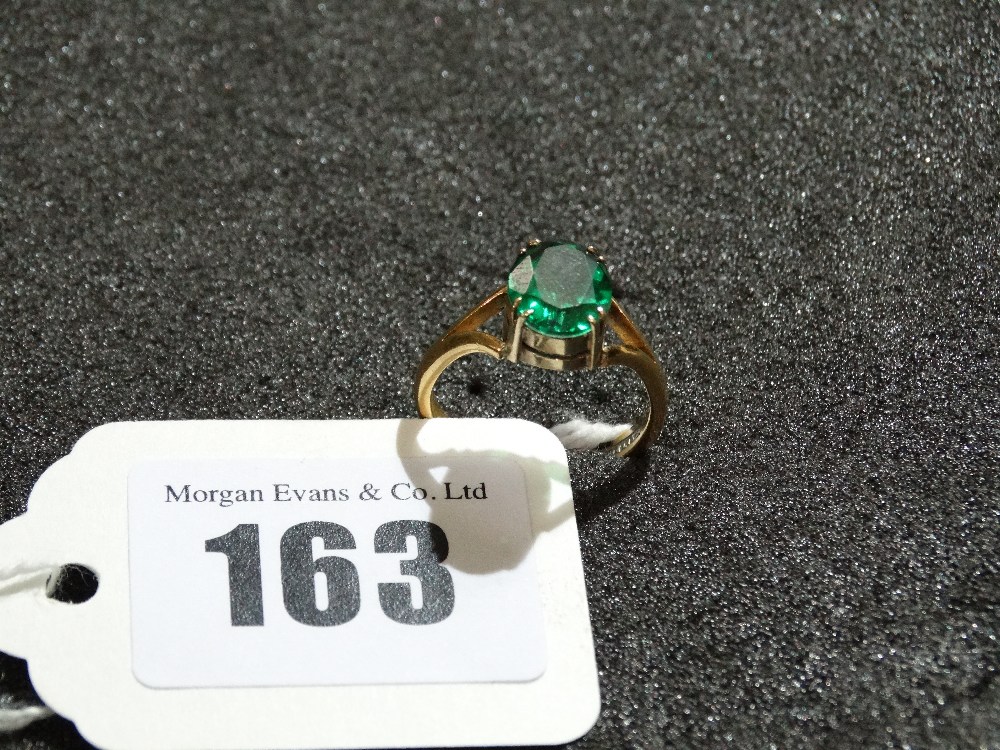 A 22 Carat Gold Green Stone Fidelity Ring