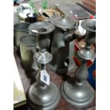 A Pair Of Circular Based Pewter Candle Holders Together With Further Pewter Ware