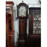 An 18th Century Mahogany Encased Long Case Clock, The Hood Enclosing An Arched Brass And Silvered