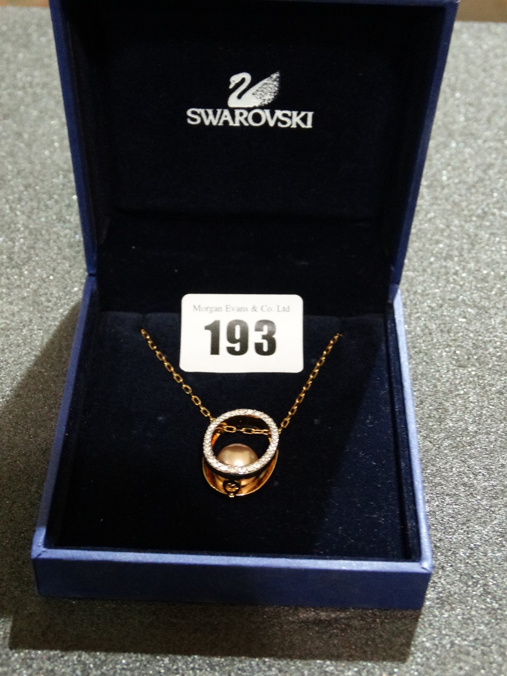 A Boxed Swarovski Crystal And Pearl Pendant And Fine Link Chain