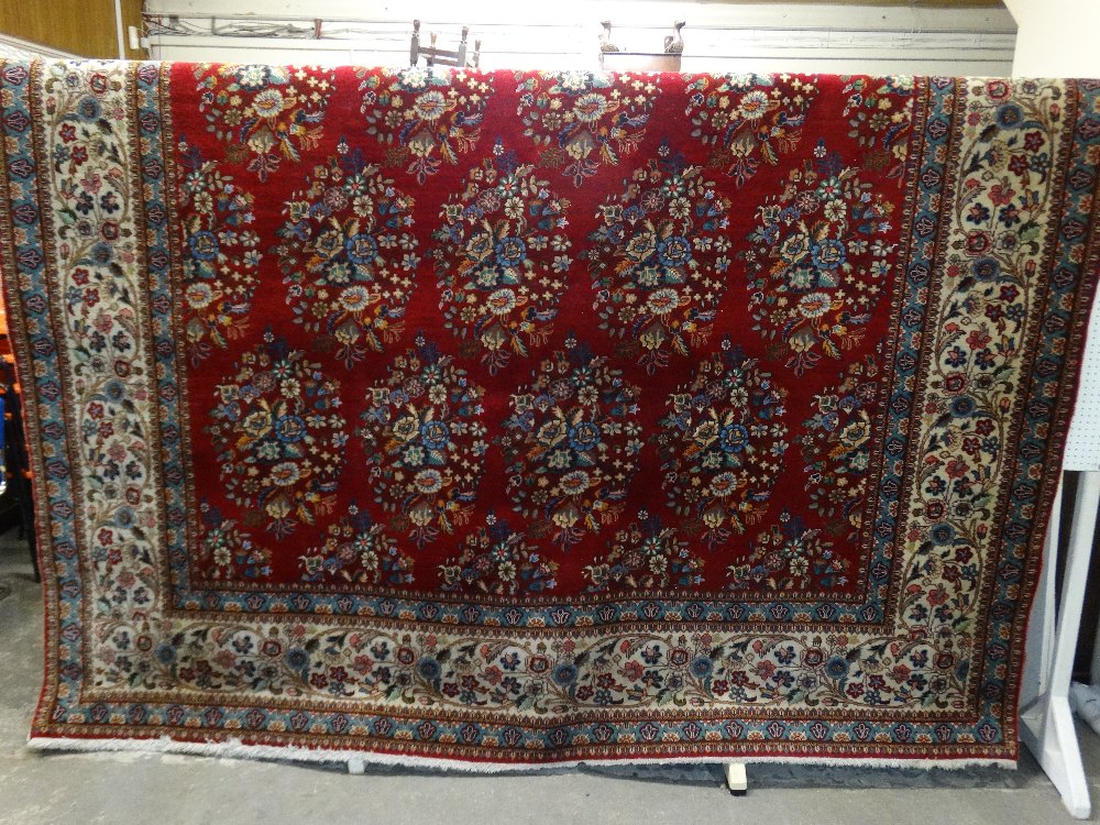 An Excellent Floral Pattern Red Ground Tabriz Woollen Carpet, 18'11" X 9'7"