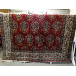 An Excellent Floral Pattern Red Ground Tabriz Woollen Carpet, 18'11" X 9'7"