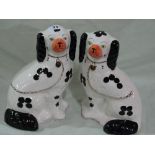 A Pair Of Arthur Wood Pottery Black And White Seated Dogs