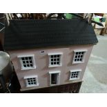 A Contemporary Dolls House And Furniture