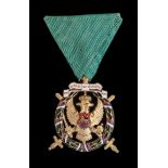 *Montenegro, Order of the Freedom of Montenegro, breast badge, in gilt and enamels, width 41mm,