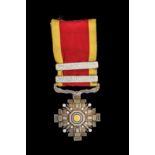 *Manchukuo, Order of the Pillars of State, Fourth Class breast badge, in silver and gilt with