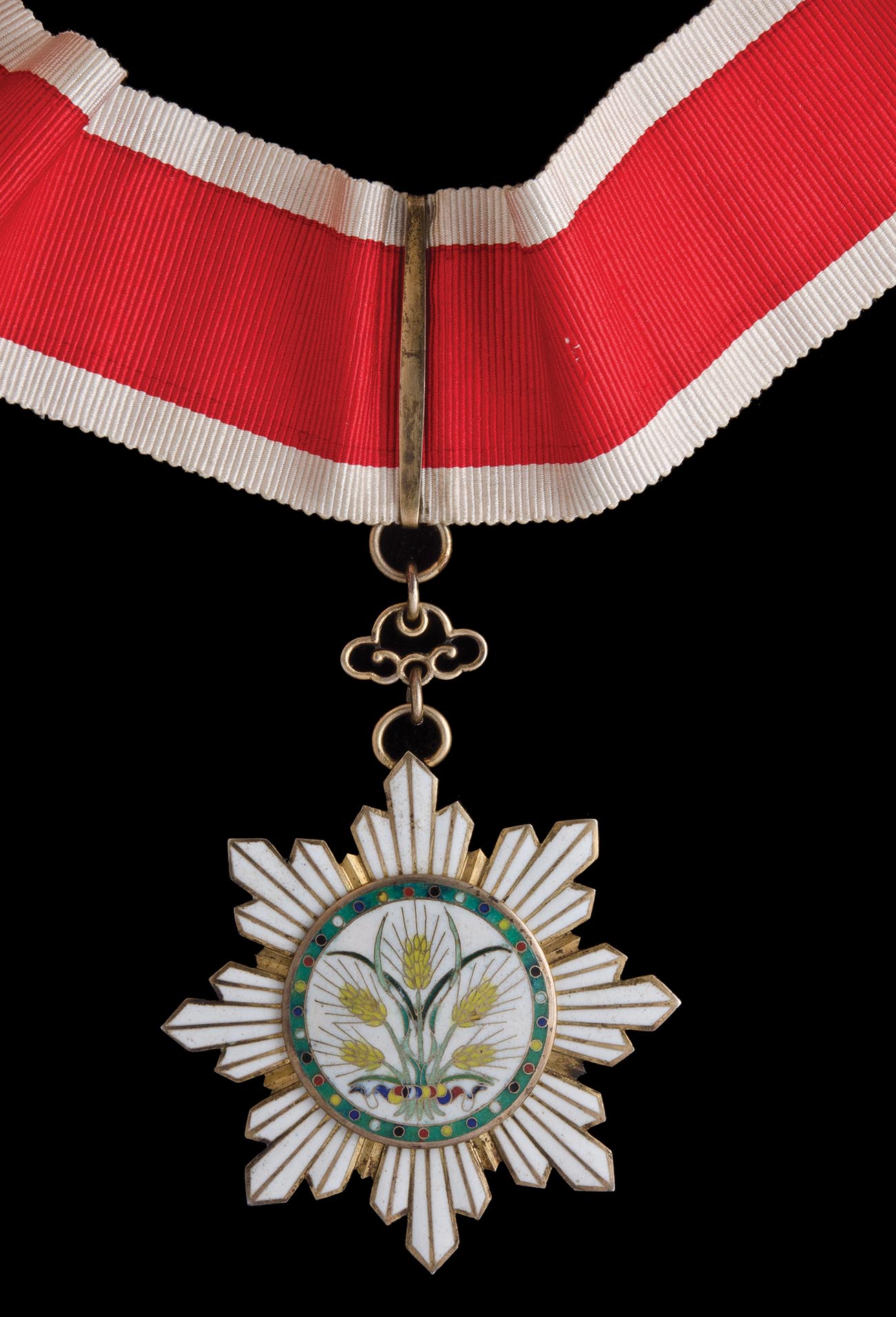 *China, Order of the Golden Grain, Third Class neck badge, in silver-gilt and enamels, width 65mm,