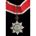 *China, Order of the Golden Grain, Third Class neck badge, in silver-gilt and enamels, width 65mm,
