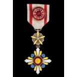 *Manchukuo, Order of the Auspicious Clouds, Fourth Class breast badge, in silver-gilt and enamels,