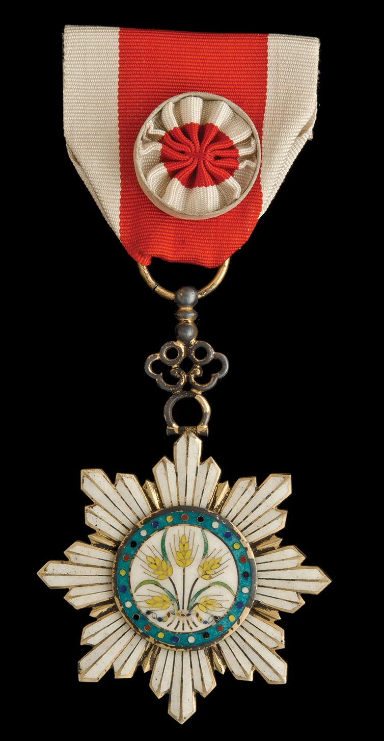 *China, Order of the Golden Grain, Fourth Class breast badge, in silver-gilt and enamels, width