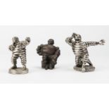 MICHELIN: A group of 3 metal-cast Bibendum figurines in various poses; tallest 11cms.