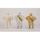 MICHELIN: A group of plastic Bibendum figurines, in clear, cream and cream with coloured sash; all