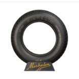 MICHELIN: 1930s double-sided "MICHELIN" tin tire display stand and associated tire from the same