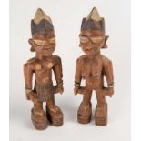 A pair of west African painted and carved Ere Ibeji figures, 20th century  A pair of west African