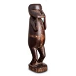 A Standing Figure Massim Region, Trobriand Islands, Papua New Guinea (circa 1900)  A Standing Figure