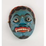 A Balinese painted wooden dance mask, 20th century  A Balinese painted wooden dance mask, 20th