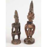 Two west African carved Ere Ibeji figures, 20th centuryTallest 31cm high  Two west African carved