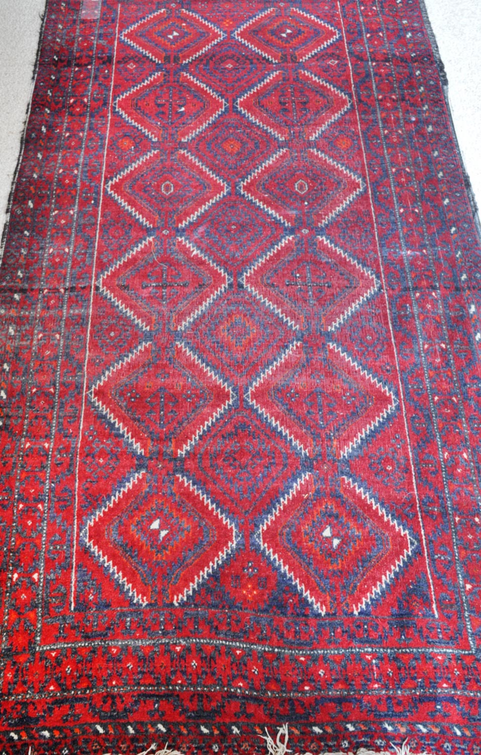 A Turkoman tribal rug, north-east Iran, mid-twentieth century.  A Turkoman tribal rug, north-east