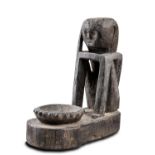 A Seated Figure with Rice Bowl Kankanay, South Ifugao, Philippines (circa 1900)  A Seated Figure