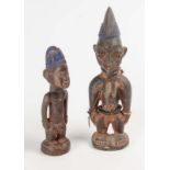 Two west African carved and pigmented Ere Ibeji figures, 20th century  Two west African carved and