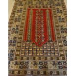 An Anatolian 'prayer' design rug, Turkey, twentieth century.  An Anatolian 'prayer' design rug,