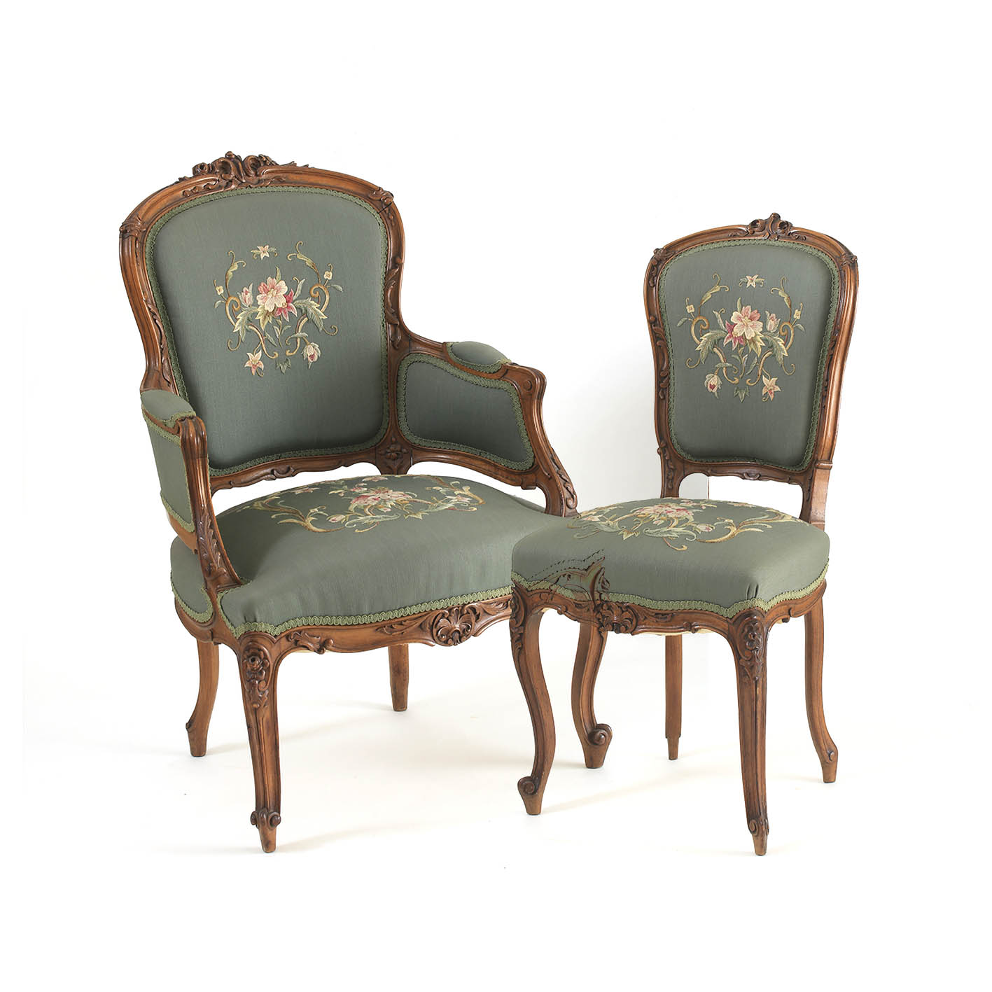 A Louis XV style carved walnut gentleman's chair and lady's chair  A Louis XV style carved walnut