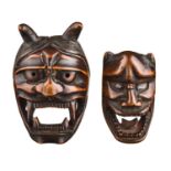 Two Japanese wood mask netsuke, 19th Century  Two Japanese wood mask netsuke, 19th Century  each one