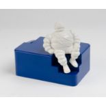 MICHELIN: A Michelin coin bank in dark blue as provided by the Michelin company to new born