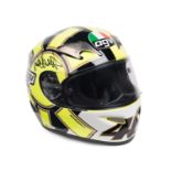 VALENTINO ROSSI: A limited edition AGV racing helmet in Valentino Rossi 2007 livery, signed and