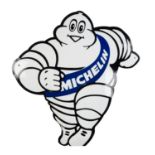 MICHELIN: A late 1990s enamel sign of a running Bibendum, 42cm high.