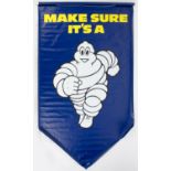 MICHELIN: A large vinyl hanging banner, circa 1990s, of running style Bibendum â€˜MAKE SURE ITâ€™S