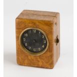MICHELIN: A 1920s Michelin electric travelling clock in full leather case with black face, 10cm